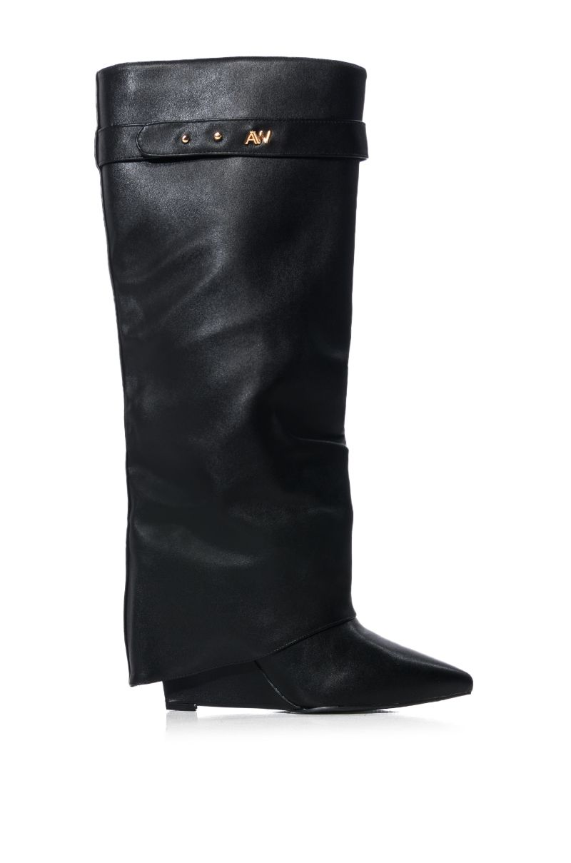 side view of fashion forward black faux leather wedge fold over boots with a pointed toe