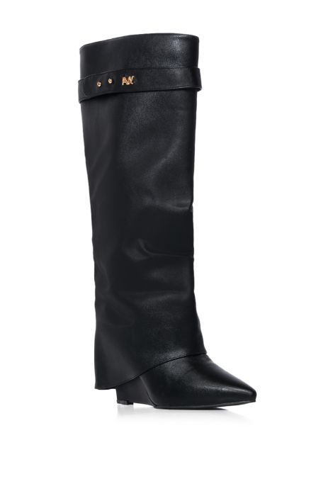 angled view of fashion forward black faux leather wedge fold over boots with a pointed toe