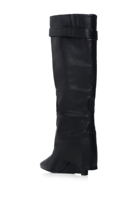 back view of fashion forward black faux leather wedge fold over boots with a pointed toe