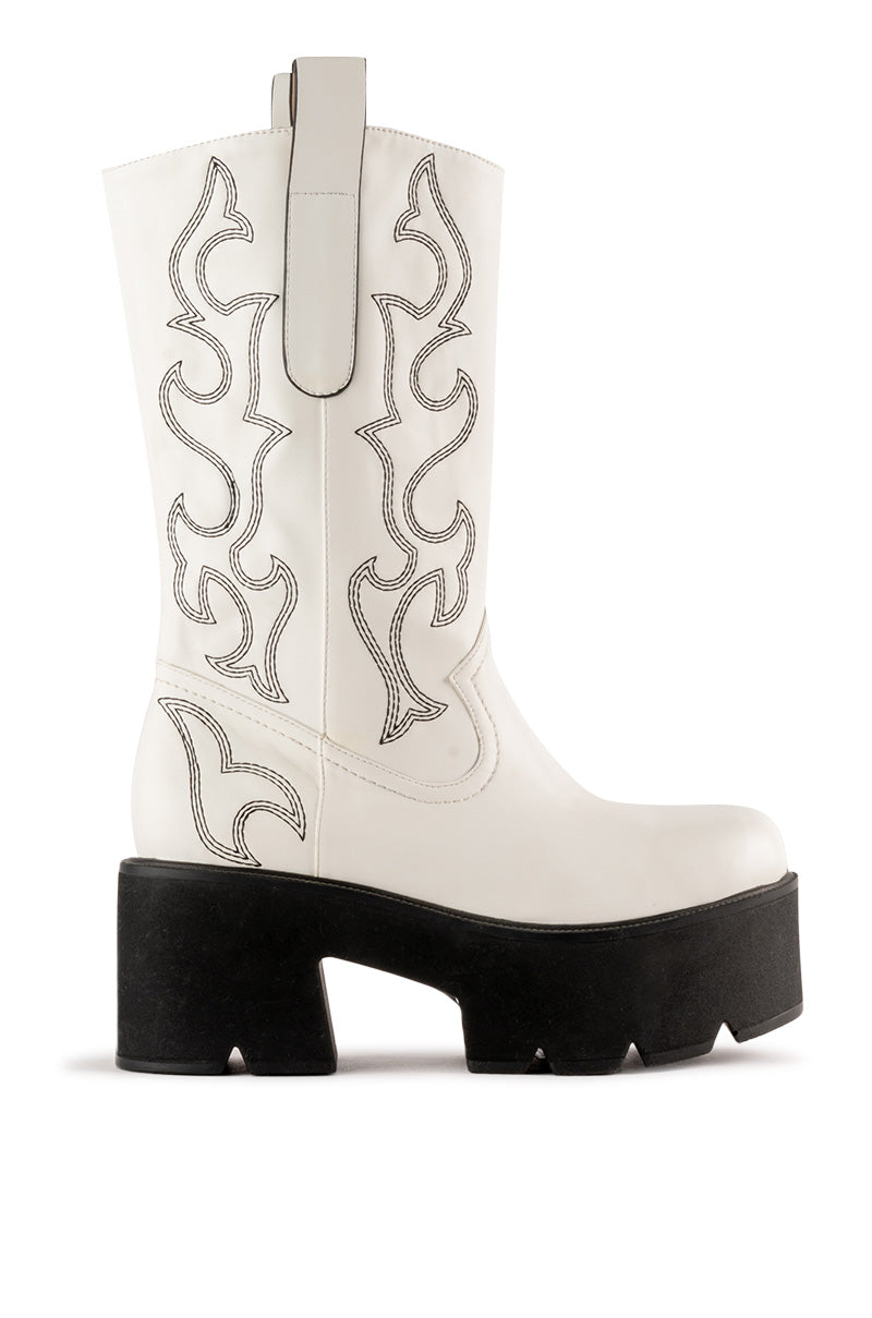 white western inspired boots with a black platform sole