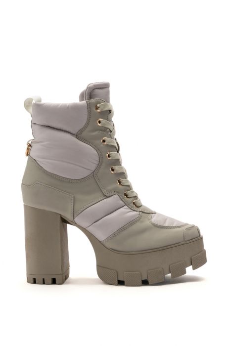 sage green platform heeled boot with lace up silhouette 