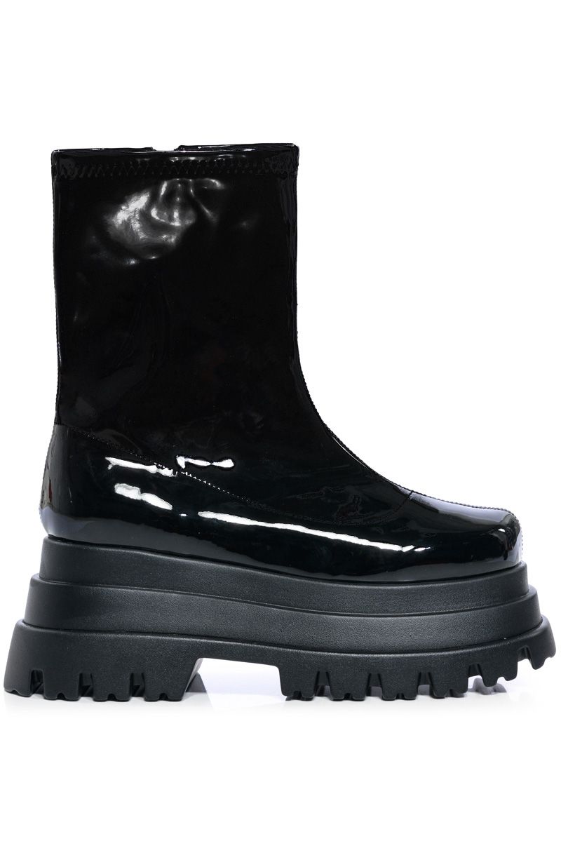 ultra platform ankle length shiny black boots with a chunky sole