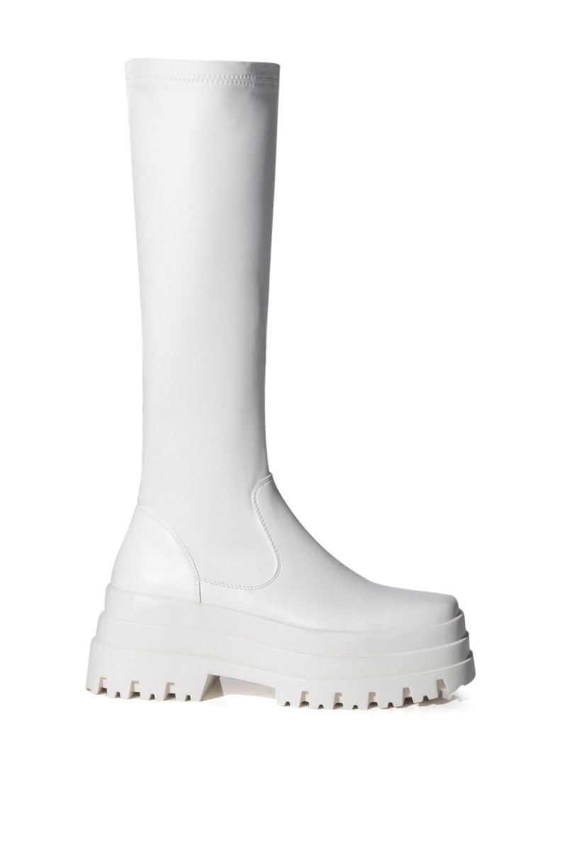 white faux leather platform boots with a tight fit