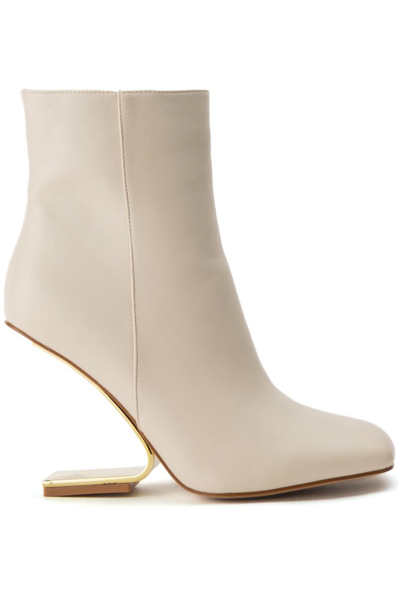 cream faux leather boots with a gold ghost heel