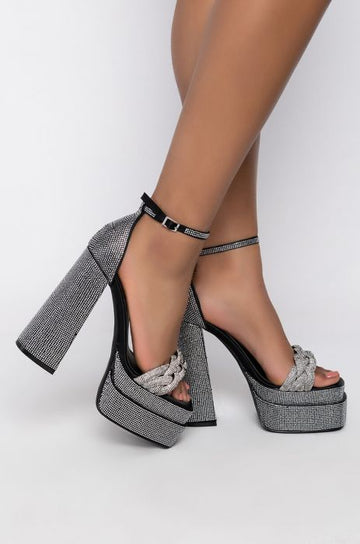 black platform open toe heels with adjustable ankle strap and bedazzled with rhinestones