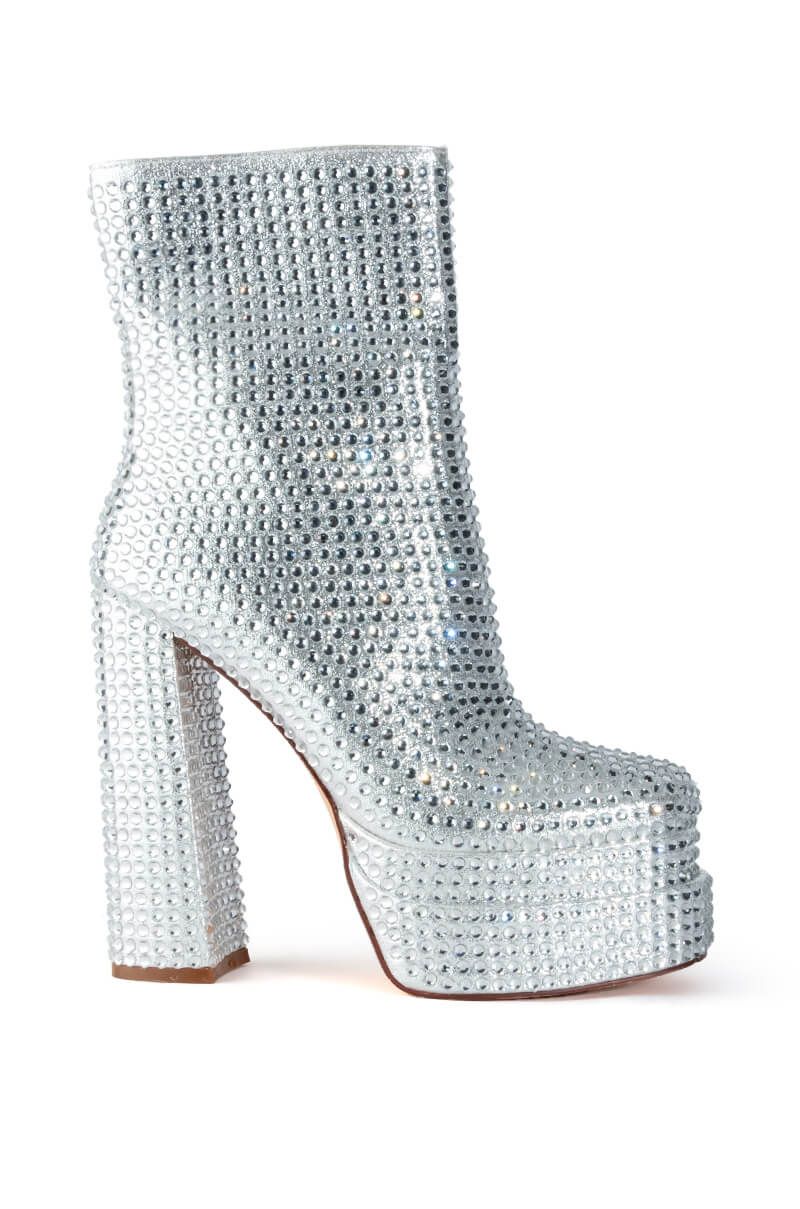 metallic silver platform heeled boots with rhinestone embellishment and a block heel