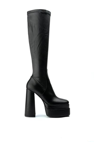 black platform heeled knee high boots with a block heel and 4 way stretch material
