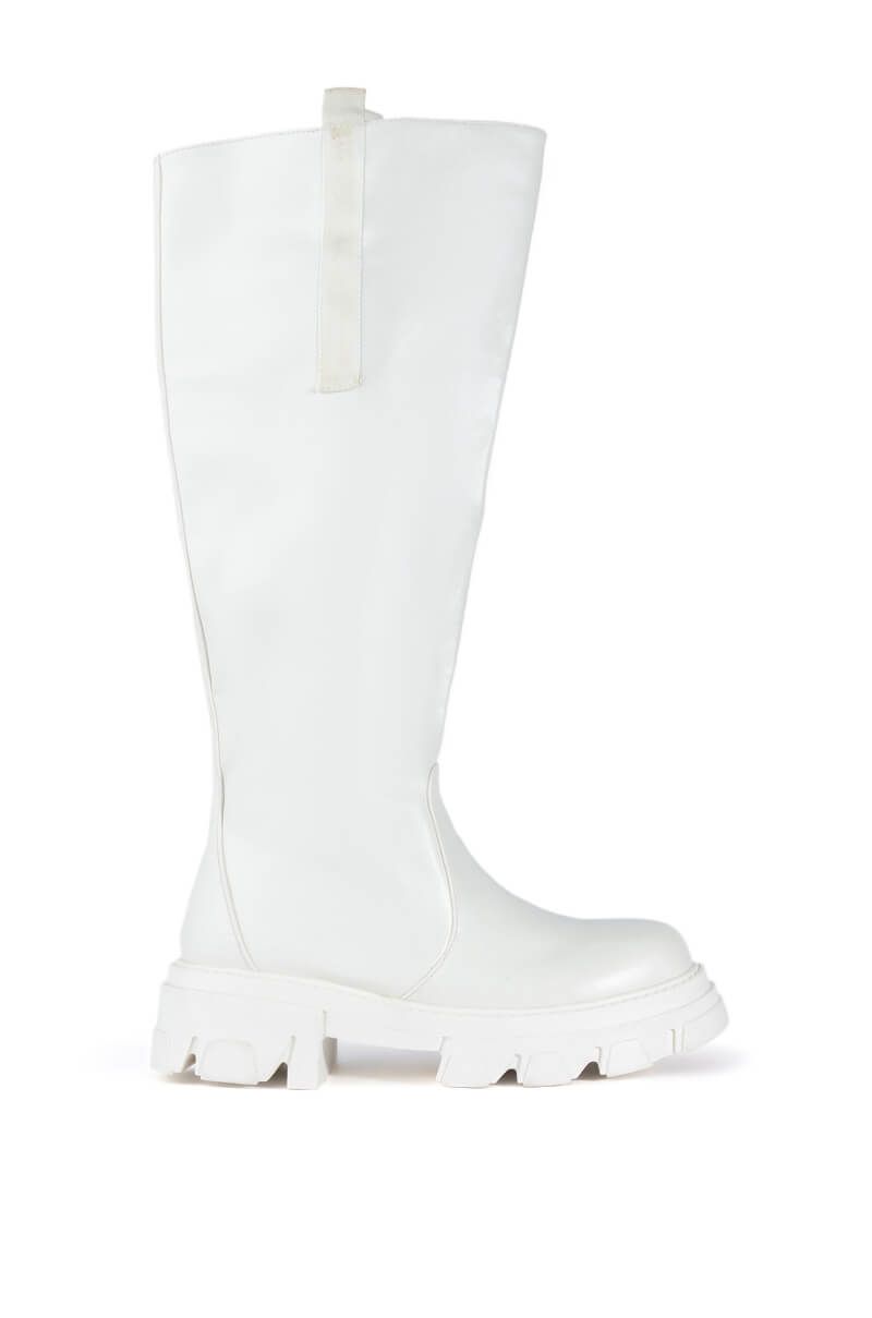 white faux leather chunky knee high boots with a flared style and chunky sole